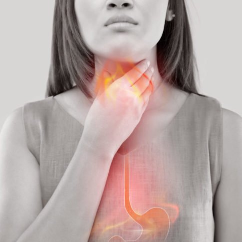 Woman Suffering From Acid Reflux Or Heartburn-Isolated On White Background